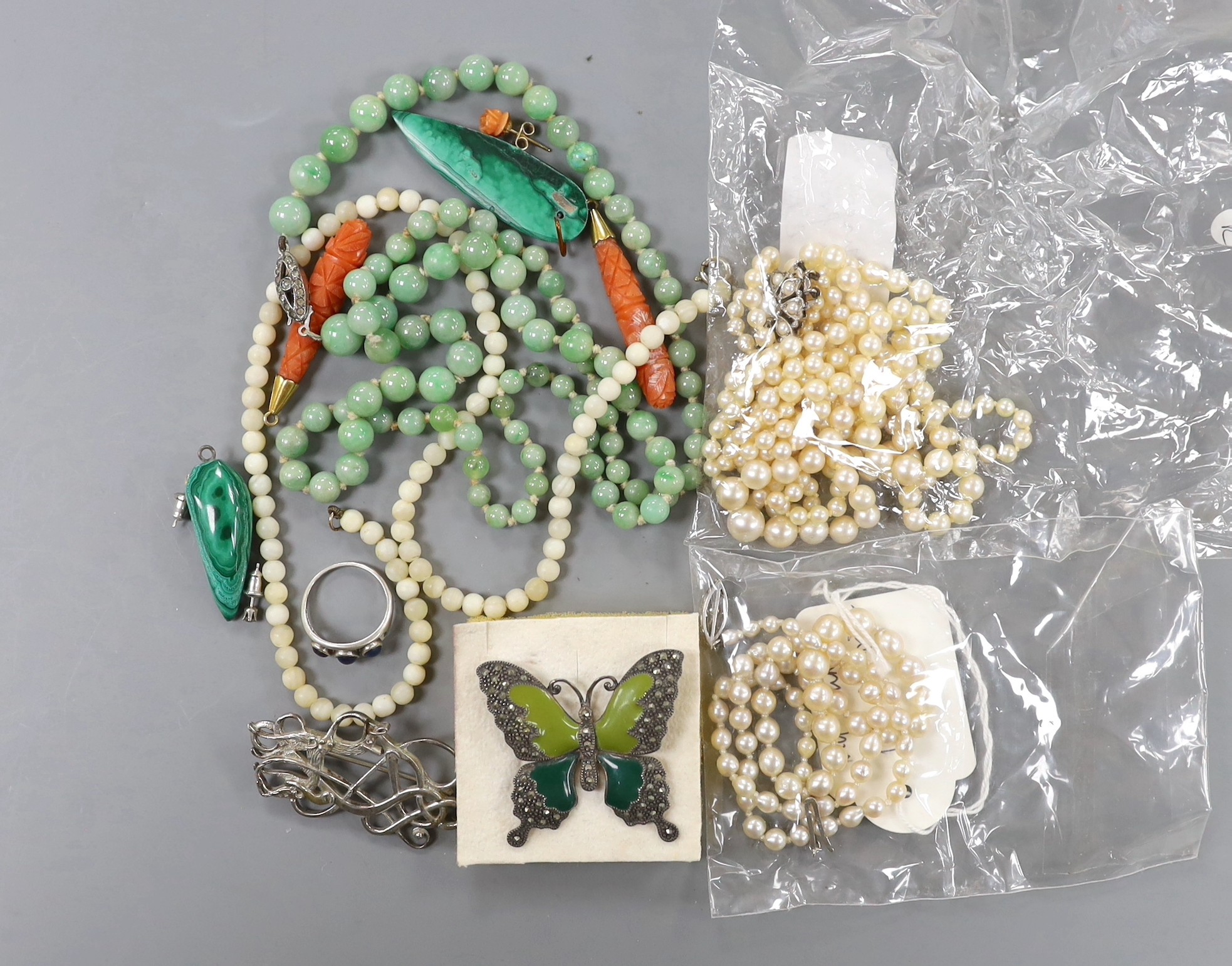 Assorted jewellery including cultured pearl necklace, jadeite bead necklace, marcasite set butterfly brooch, pair of carved coral earrings etc.